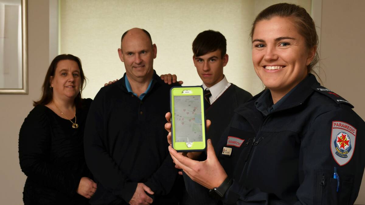 Saving a life: Jodie, Andrew and Nick Crellin with paramedic Jess Handley, who rushed to the family's Cardigan home in April after Andrew unexpectedly collapsed during a heart attack. Picture: Lachlan Bence 