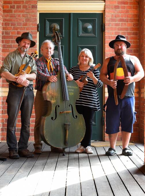 Musical merriment: Event organiser Martin Scuffins, committee member Lisa Cressey, and musicians Graham McClean and Barry Gilson. Picture: Adam Trafford 