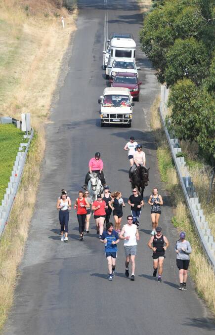 MOTIVATION: Family and friends supported the sisters along the way. Photo: Lachlan Bence 