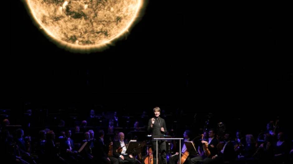 Music meets the cosmos: Brian Cox with the MSO. Picture: NICO KEENAN