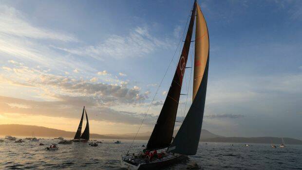 Runner-up Comanche, left, and Sydney to Hobart winner Wild Oats, right, on the River Derwent during the 2017 race. Picture by AAP