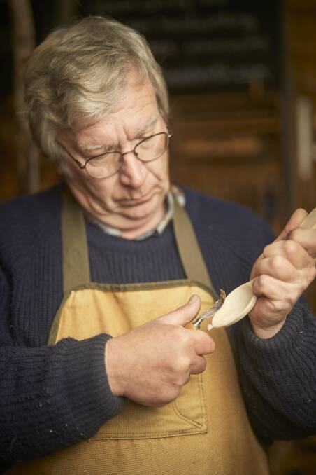 A methodical skill: Paul Ryle demonstrates the art of hand-making a wooden spoon. Picture: Luka Kauzlaric.