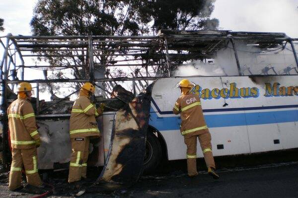 Firefighters put out the bus fire at Bacchus Marsh. Picture: CFA