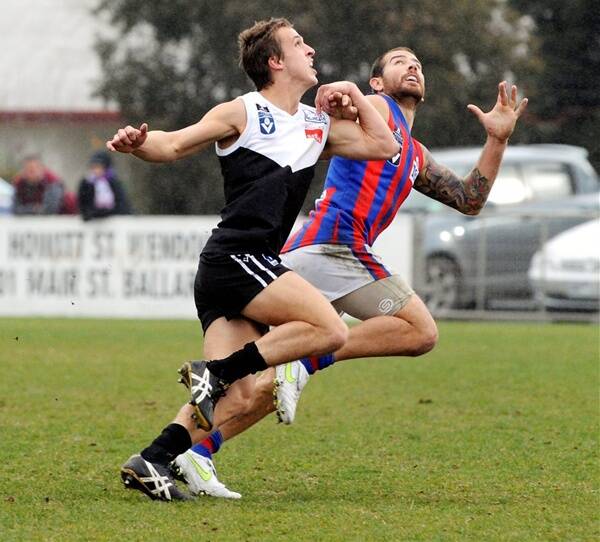 North Ballarat's Oliver Tate competes with Port Melbourne's Dean Galea. Picture: Jeremy Bannister