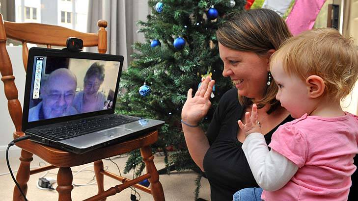 Totally tuned in … Kim McEachen and her 18-month-old daughter Iona Skyping her parents in Delaware.