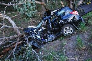 SCENE: The vehicle which veered off the Glenelg Highway and crashed into trees at Pittong yesterday. Photo: Kate Healy.