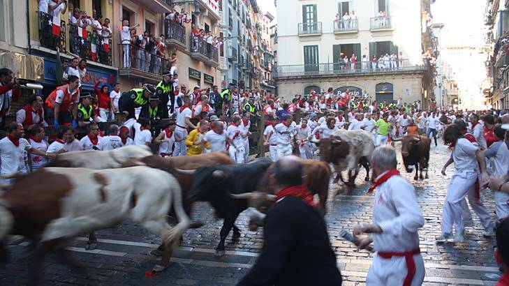 Hundreds take to the streets: The Running of the Bulls is the most important tradition for San Fermin, and it is also the most dangerous. Photo: Kathryn Gall