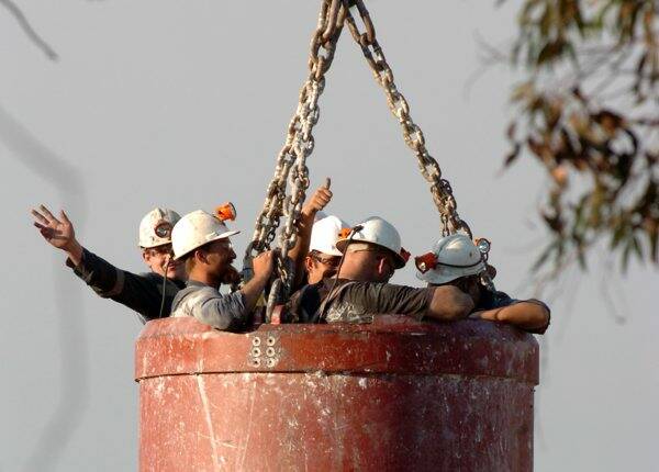 A group of miners are hoisted to safety after a rock fall at Ballarat Goldfields' Woolshed Gully operation on November 19, 2007.