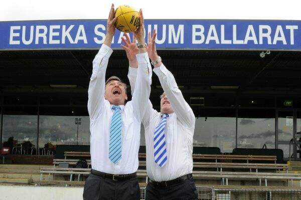 UPGRADE PROMISE: Victorian Premier John Brumby and North Melbourne Football Club chief executive officer Eugene Arocca attempt a mark after announcing a $30 million plan to upgrade Eureka Stadium to AFL-match standards. Picture: Jeremy Bannister