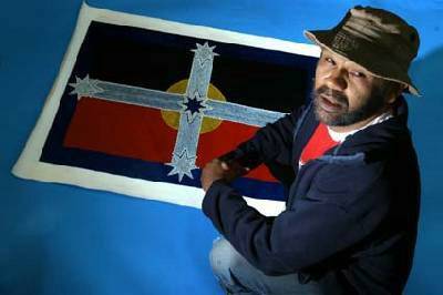 CREATIVE: Ballarat artist Peter Clarke with his symbolic flag incorporating the Aboriginal and Eureka flags. Picture:Eugene Hyland.