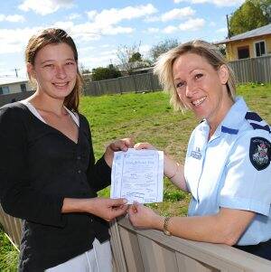 GET TO KNOW YOUR NEIGHBOUR: Wendouree West resident Sarah Schoefbaemker and Senior Constable Janine Walker in Wattle Avenue where a house, occupied by a woman who died a lonely death, stood until a few months ago. Picture: Kate Healy 