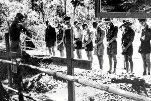 SERVICE: Australian World War II soldiers bow their heads during the 1943 funeral of a prisoner of war who died at the hands of Japanese forces during the construction of the Burma-Thailand railway in Burma.