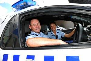 In uniform: Police officers, Superintendent Craig Gillard with his daughter, Constable Jaime Gillard, work together on a shift in Ballarat. Picture: Kate Healy