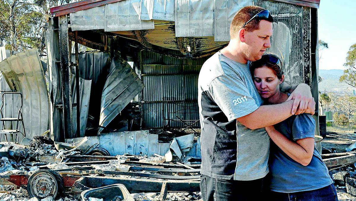 Geoff and Nicole McKenzie at their property, destroyed by bushfire.