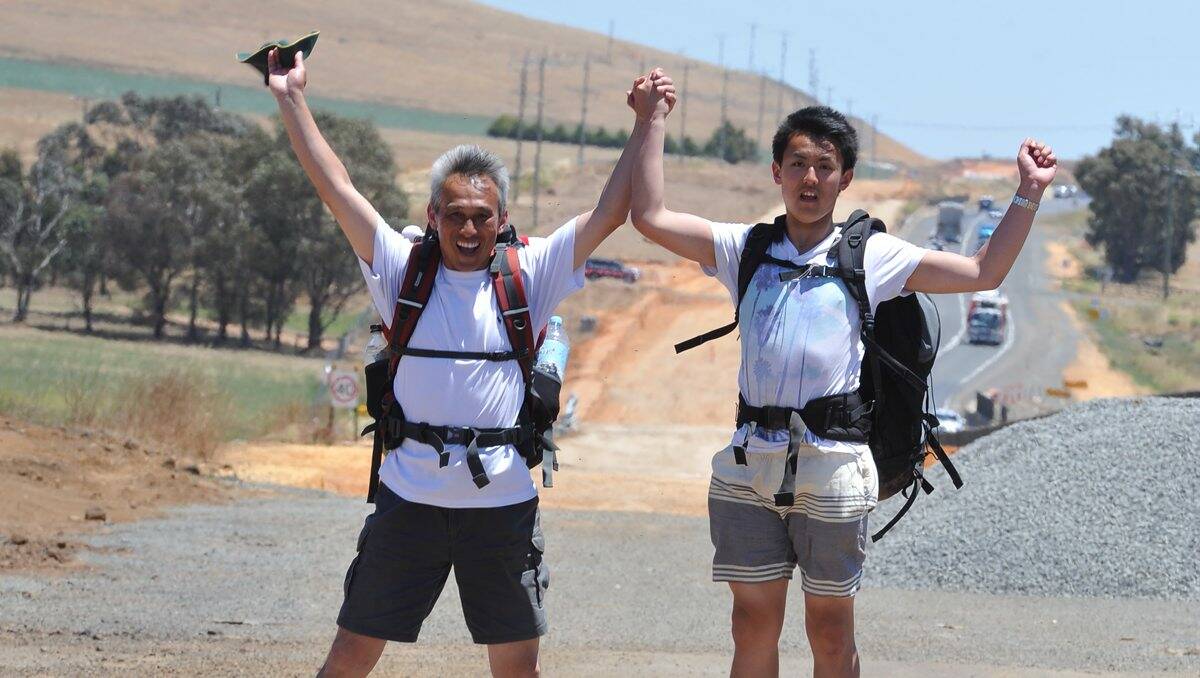 JOURNEY: Walkers Charles Zhang and his son Oscar are set to arrive home today after walking from Robe to Ballarat. PICTURE: LACHLAN BENCE