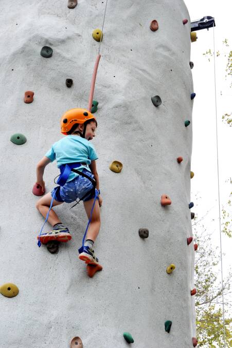 Jake Connolly tries out the climbing wall. PICTURE: Jeremy Bannister.