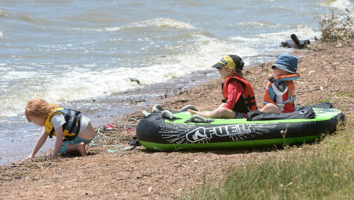 Archie Toering, 4, Angus Siemensma, 5, and Charlotte Siemensma, 2 at Lake Burrumbeet. PIC: KATE HEALY