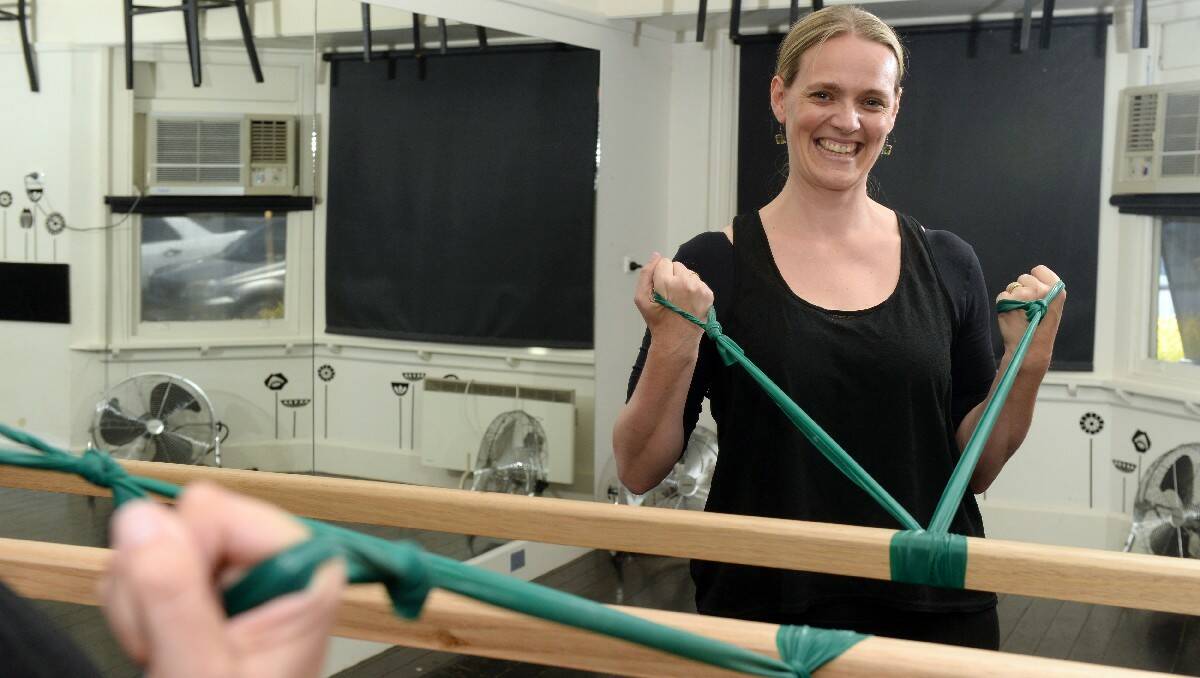 Narelle Tolliday at Curtain Call Studio is the first to introduce a new exercise craze, Barre Attack which combines pilates and ballet. PIC: KATE HEALY