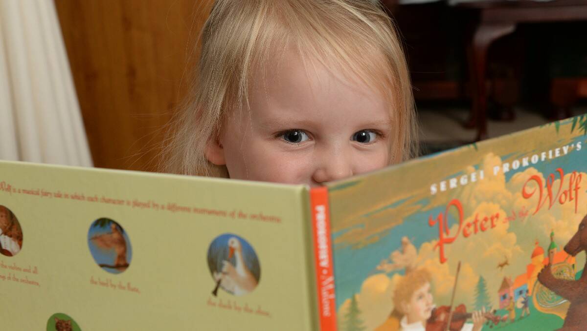 Elsa Duffy, 3 enjoys reading. PIC: KATE HEALY