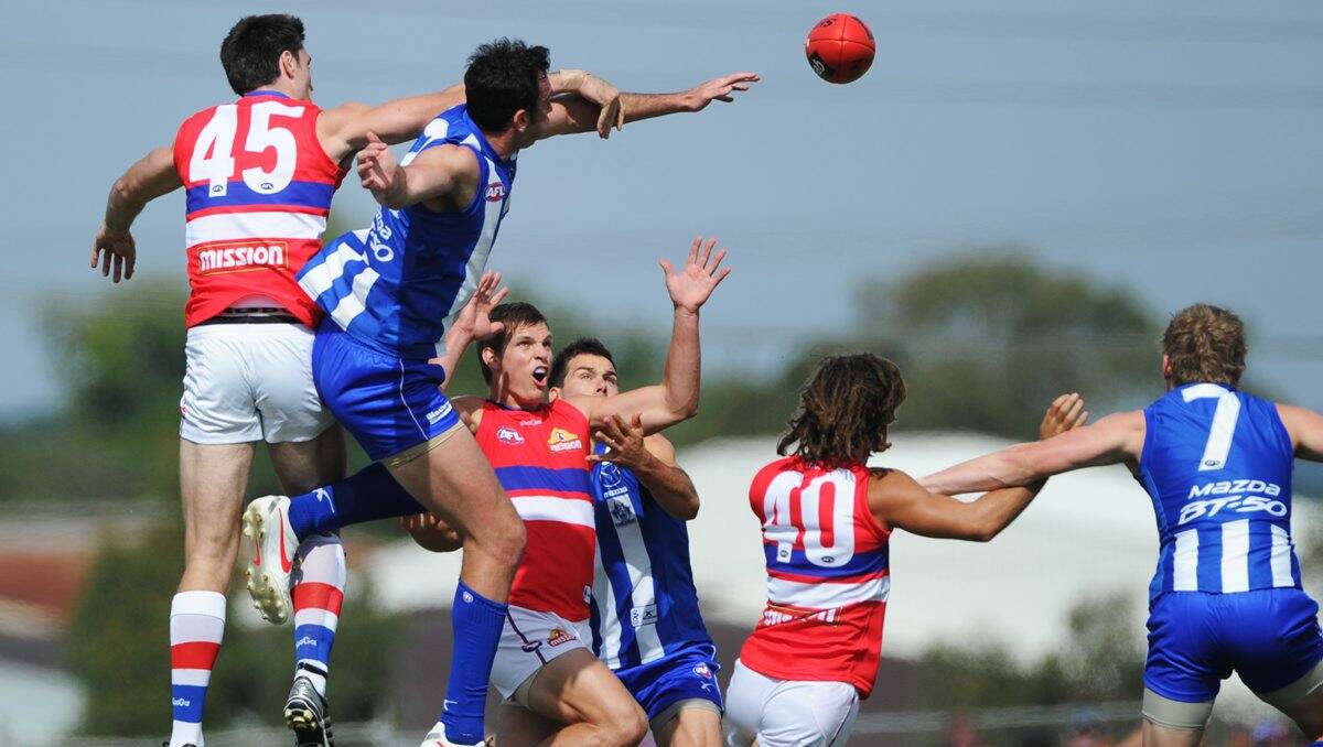 ACTION: Last year's game between North Melbourne and Western Bulldogs. PICTURE: JUSTIN WHITELOCK
