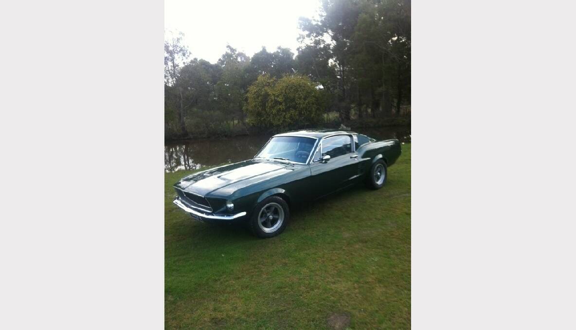 49) This is Daniel Pyne's 1967 Fast Back Mustang in a dark moss green.
