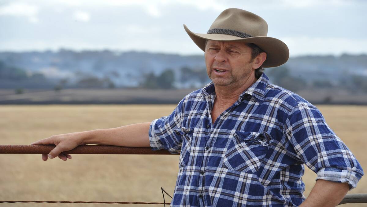 Farmer Geoff Bruty talks of how the fire started. PICTURE: LACHLAN BENCE.