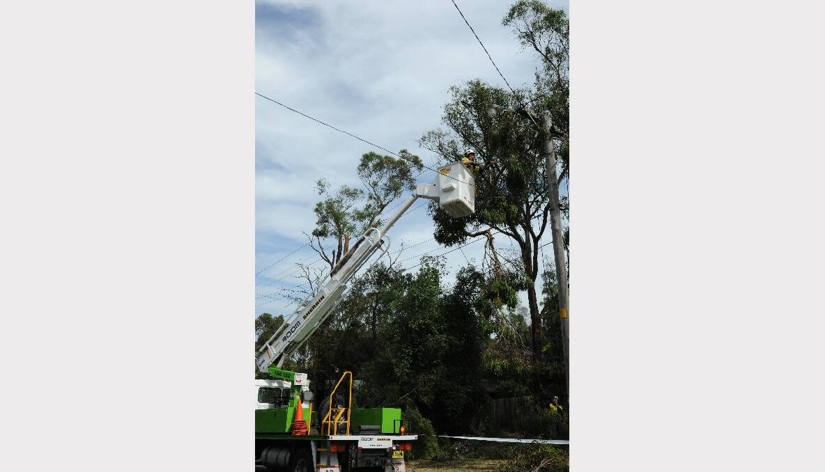 Graeme Smith assesses the damage in Marina Drive, Mount Clear. PICTURE: LACHLAN BENCE.