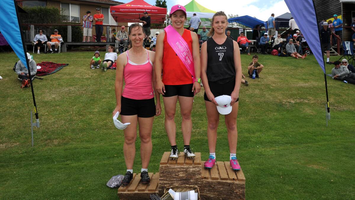 Anglea Byrt stands on top of the podium with placegetters Jacqui Scott (right) and Sonya Pollard