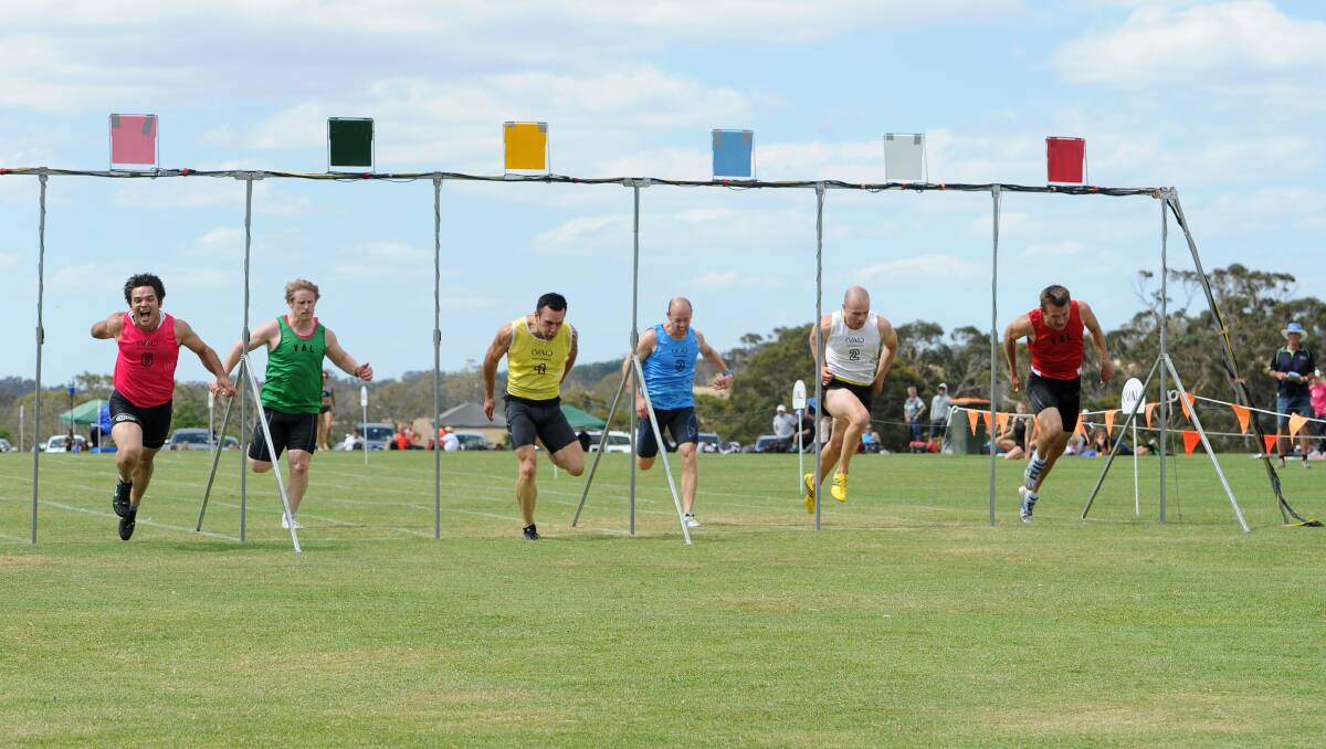 Marty Sinclair, donning pink,  throws himself at the line to win the Daylesford Gift