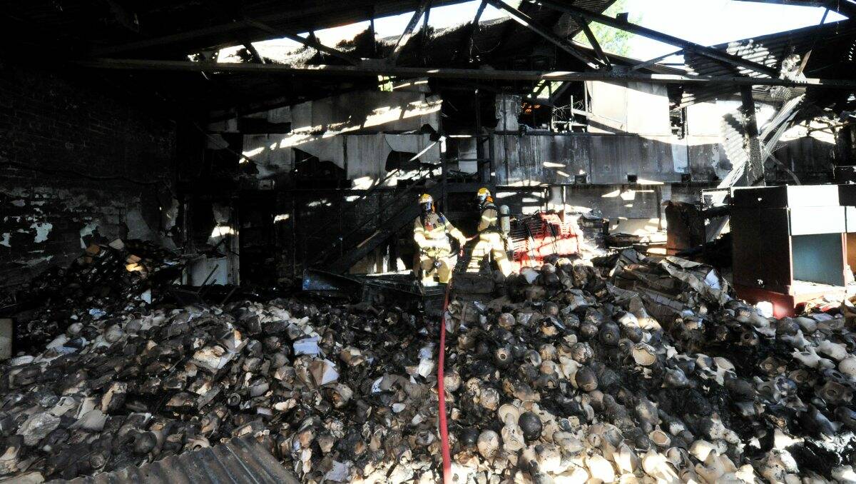 Fire crews inspect the damage inside what was the Plaster Fun House in Ballarat. PIC: Jeremy Bannister