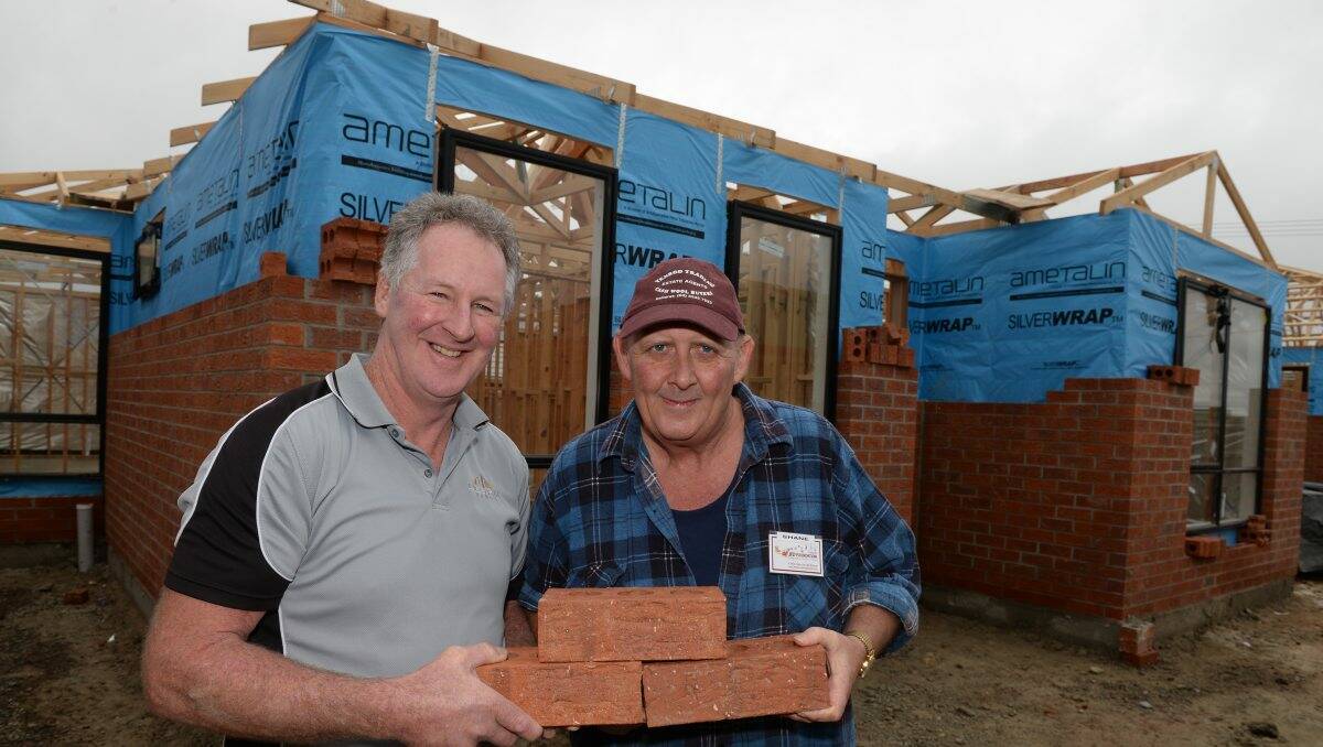 Shane Dorney with builder Des Rix during construction