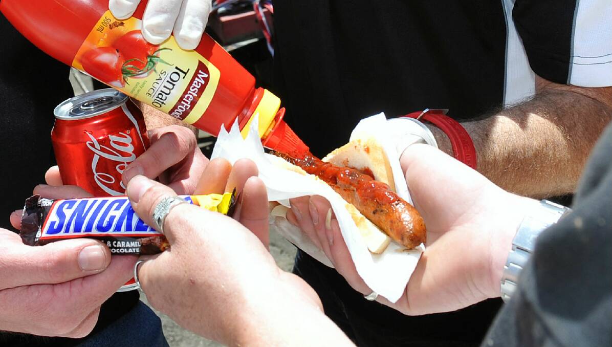 Having your say always goes better with a sausage on election day. PICTURE: THE COURIER