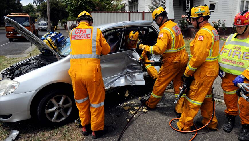 Emergency workers rescued two people who were trapped after a two-car crash today. PICTURE: JEREMY BANNISTER