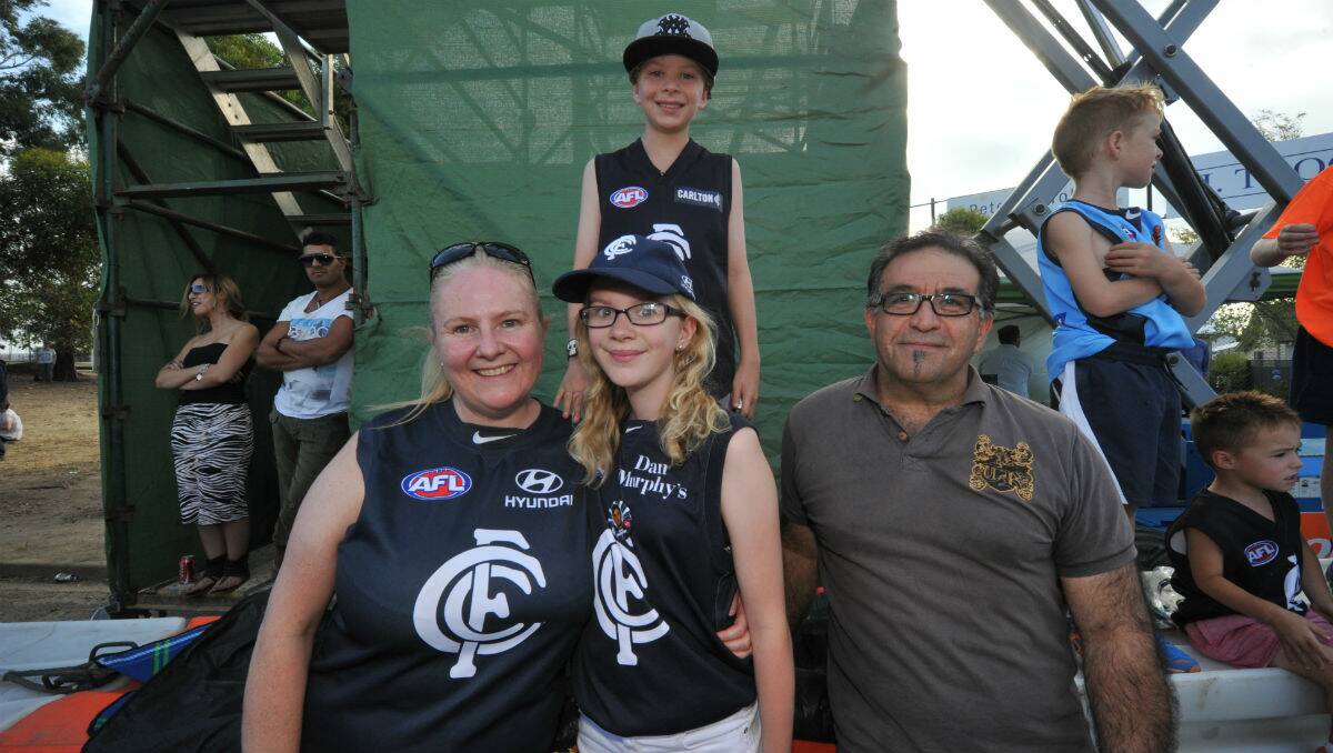 Tracey, Lachy and Lily Moroney with Fouad Hallaby at Eureka Stadium. PICTURE: JEREMY BANNISTER