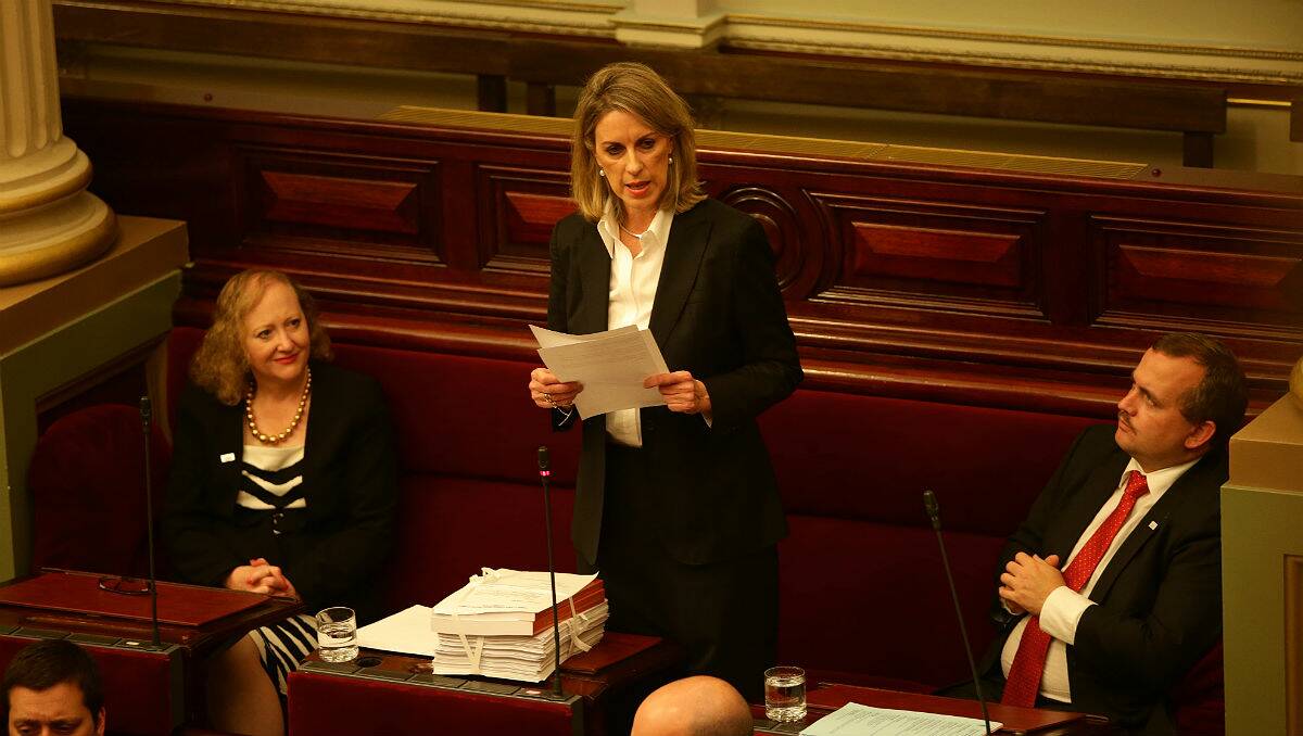 Georgie Crozier reads the findings of the inquiry into institutionalised child sex abuse. PICTURE: JASON SOUTH