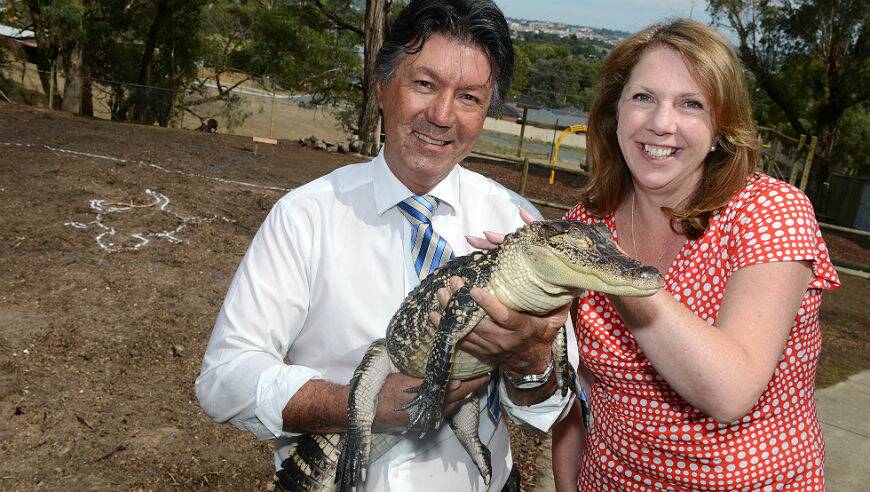 Park owner Greg Parker and MP Catherine King holding Gump the alligator. PICTURE: KATE HEALY