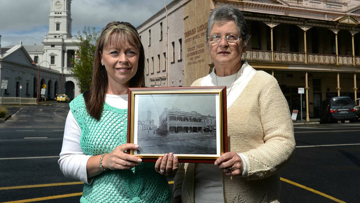 Louise Crump and her mother Margaret Clarke with one of the photos from the family heirloom book. PICTURE: ADAM TRAFFORD