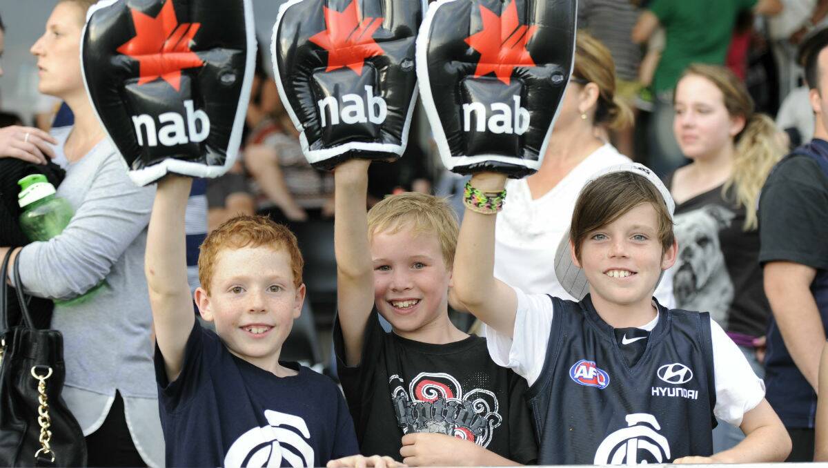 Chevy Smart, 8, Sam Baulch, 8 and Jy McGrath, 10, at the NAB Challenge match last night. PICTURE: JEREMY BANNISTER