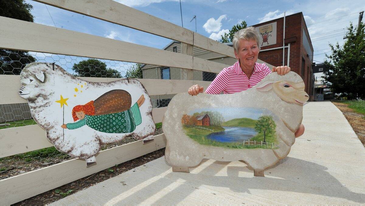Margaret Cooper with some of the decorated Meredith sheep PICTURE: LACHLAN BENCE