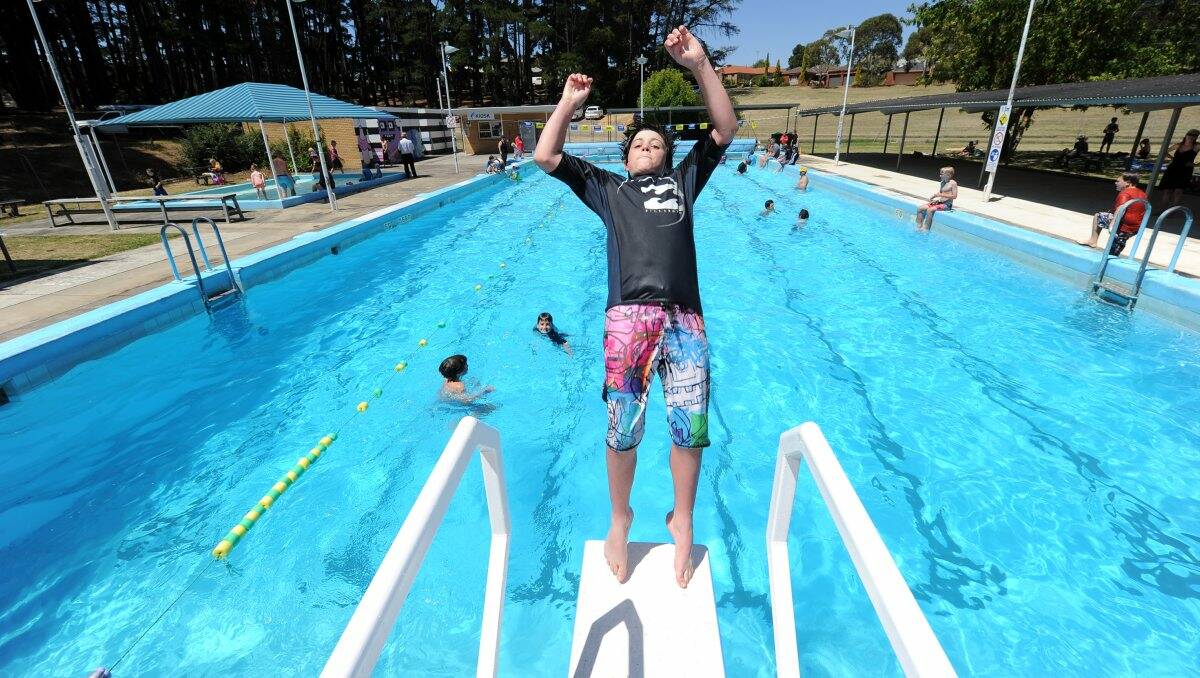 Oscar Ford, 12, takes a big dive at the Black Hill swimming pool. PICTURE: JUSTIN WHITELOCK