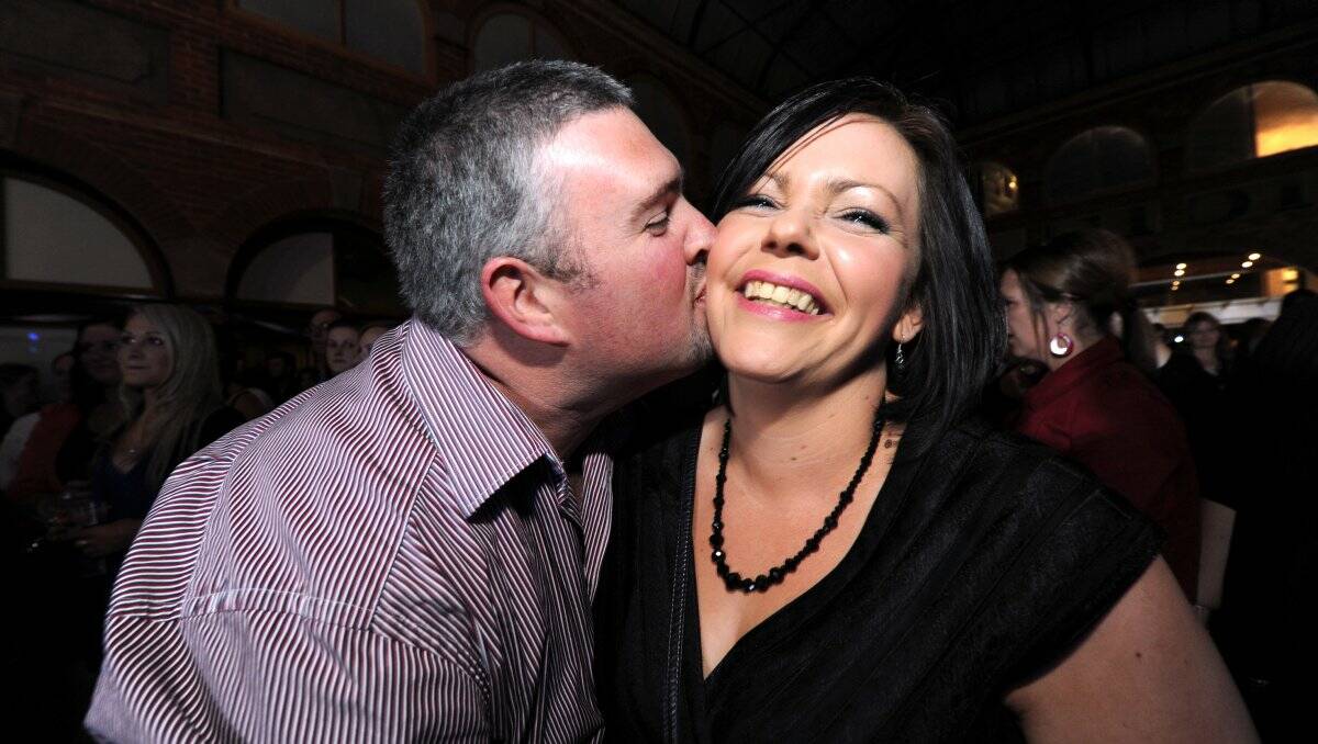 Nick Latch tries to steal a kiss from Emma Knights at the successful Waubra Wants a Wife event on Saturday night.