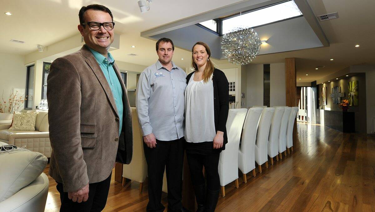 Australia's Best Houses host and producer Gary Takle with home owners David and Marcella Moyle.