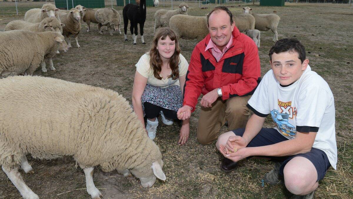 Sean Simpson volunteers at the Ballarat Specialist School farm, where he helps out with technical information. He's pictured with students Natasha Albon and Joe Wheeler. PICTURE: KATE HEALY