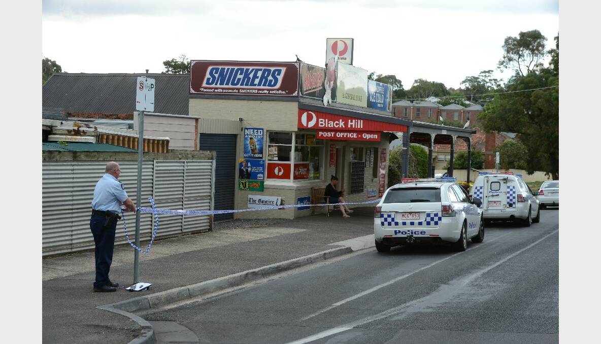 Police examine the scene of an armed robbery in Black Hill. PICTURE: KATE HEALY