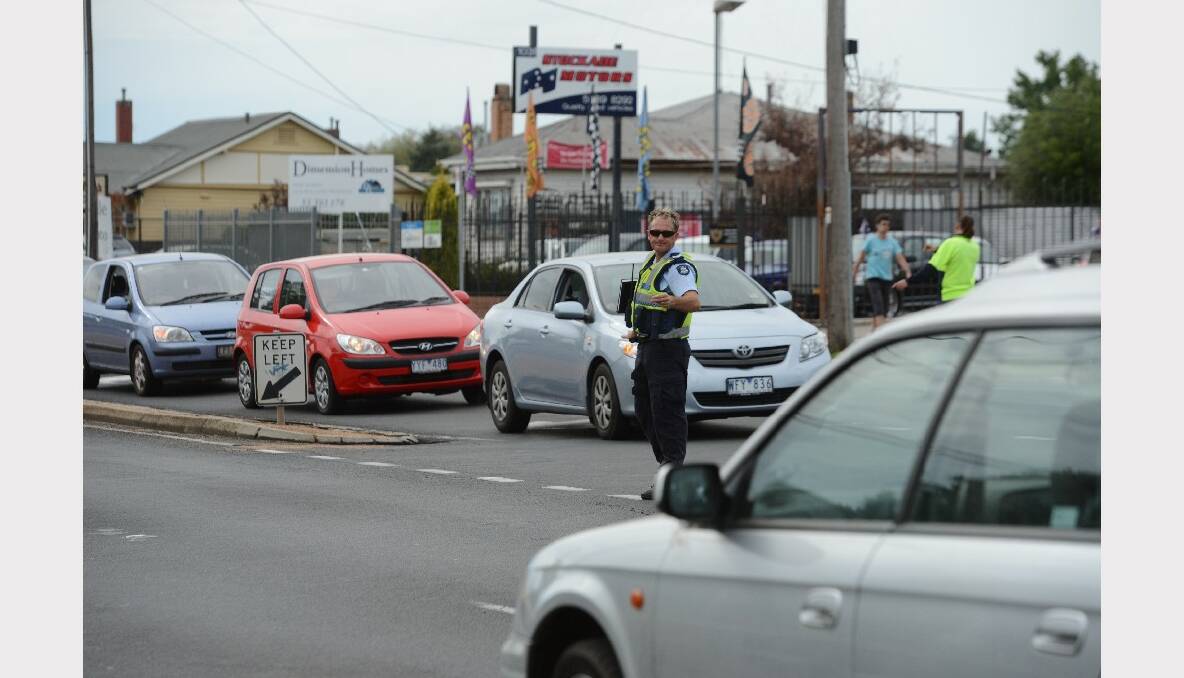 Police are diverting traffic around a fallen power pole in Wendouree this morning. PICTURE: KATE HEALY