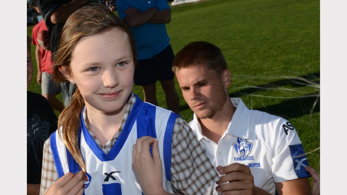 Gabby Macdonald, 9, of Cardigan Village with North Melbourne's Taylor Hine. PICTURE: KATE HEALY