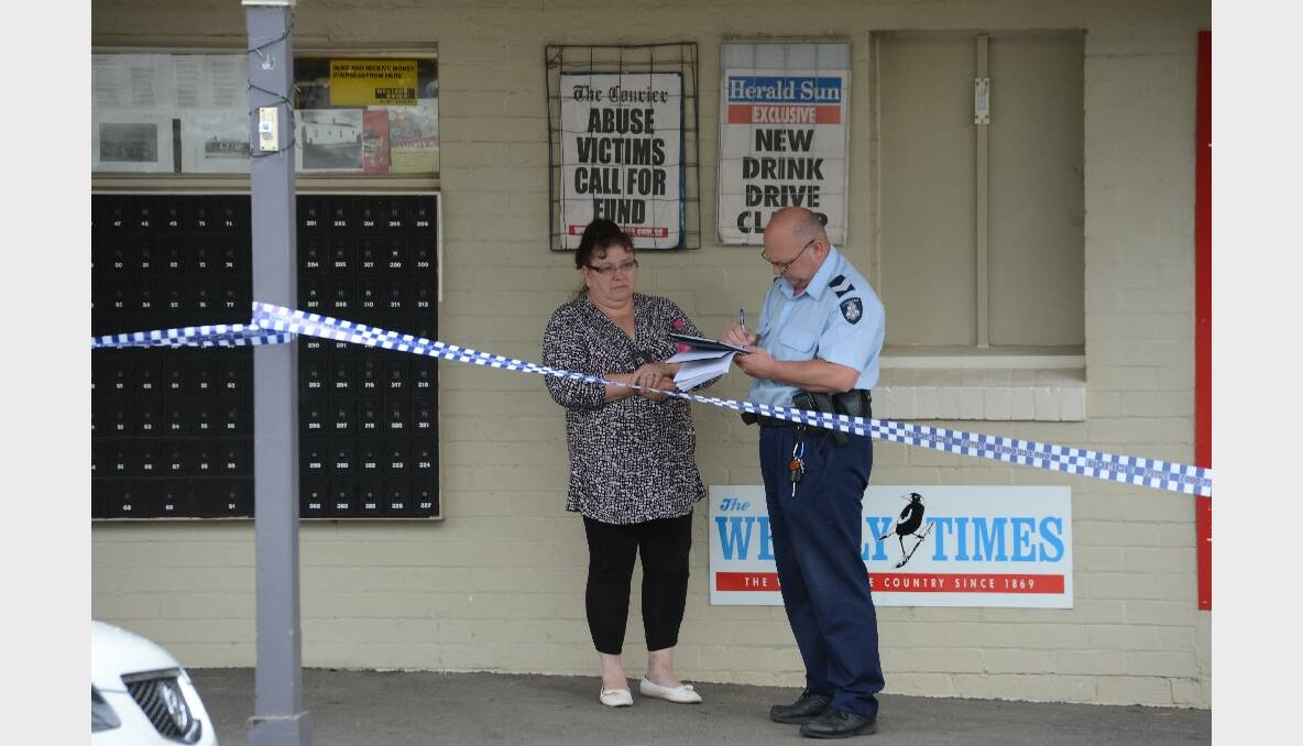Police talk to witnesses after an armed robbery in Black Hill. PICTURE: KATE HEALY