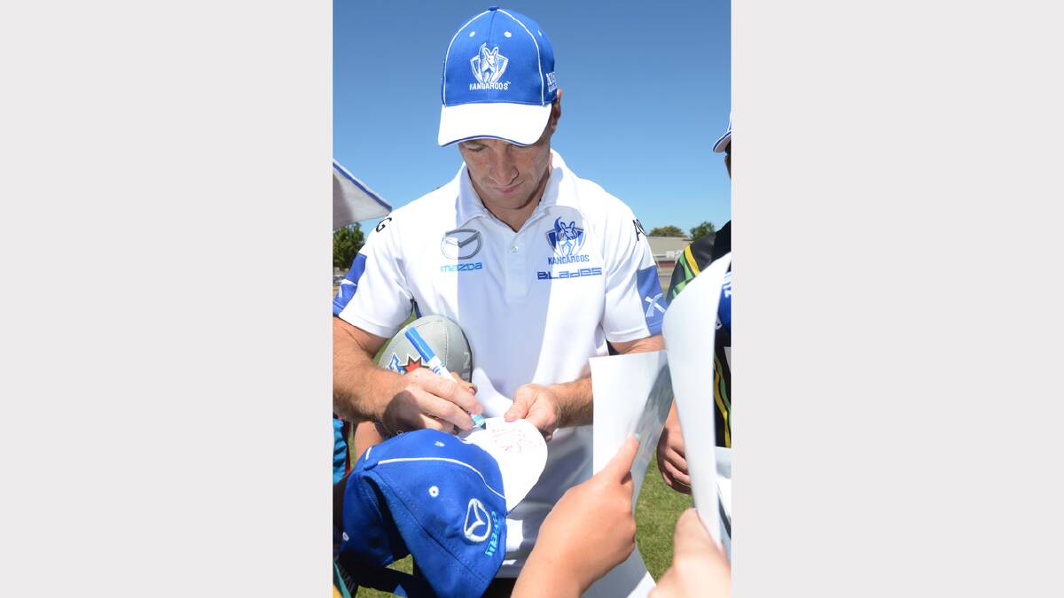 Brent Harvey signing autographs. PICTURE: KATE HEALY