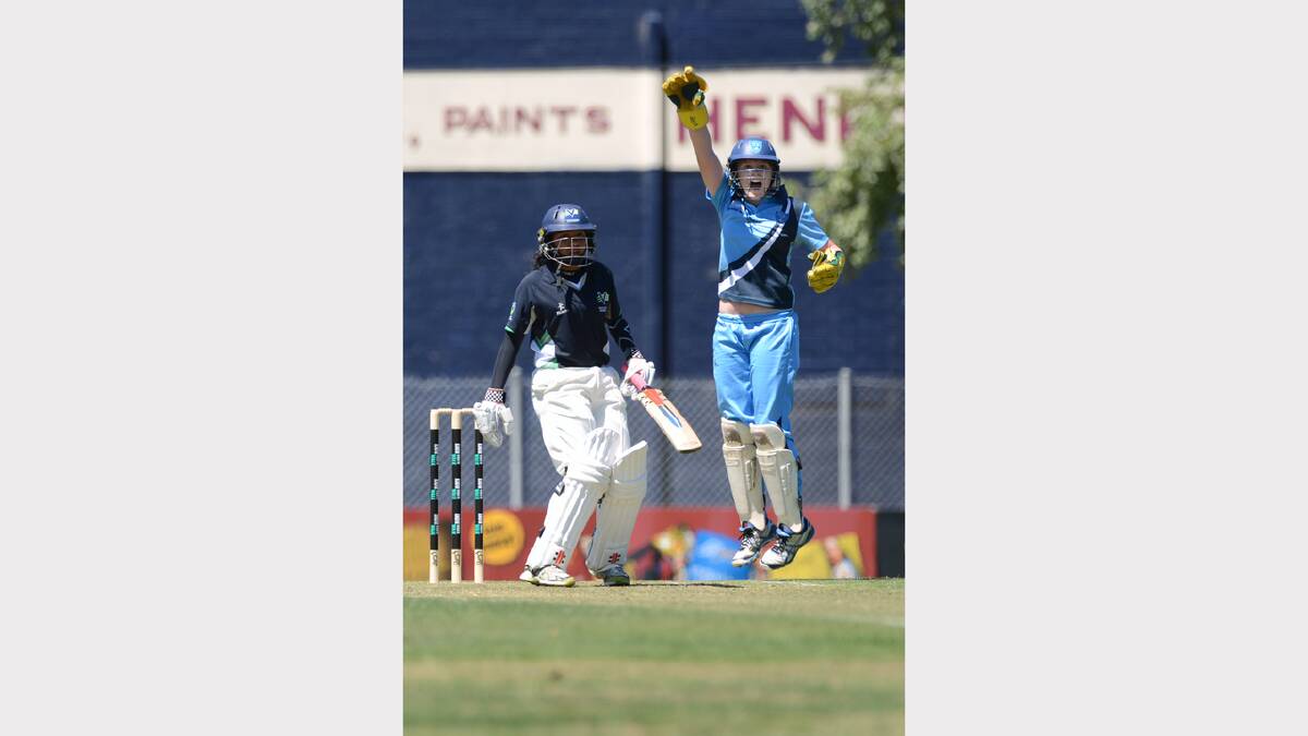 AUSTRALIAN UNDER 18 FEMALE CRICKET CHAMPIONSHIPS. Victoria v NSW. Victoria's Alana King batting, Lily Bardsley of NSW wicket keeping. PICTURE: ADAM TRAFFORD