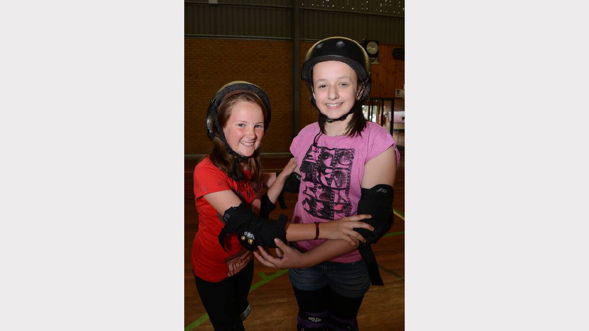 Chloe Porter, 11, and Jaime Gogliotti, 11, at the school holidays fun skate session at the Doug Deans Sports Stadium. PICTURE: KATE HEALY. 